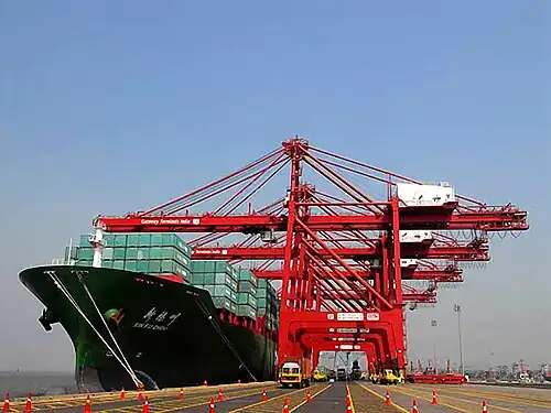Harbour cranes unload cargo from a container ship at the Jawaharlal Nehru Port in Navi Mumbai, India.