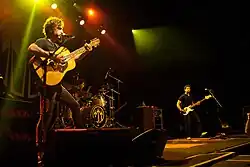 The John Butler Trio (left to right: John Butler on guitar, Nicky Bomba on drums, Byron Luiters on bass) performing in Toronto c. 2012