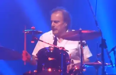 Coghlan in 2013, performing with Status Quo in Manchester