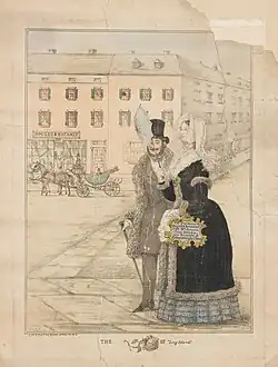 A man and a woman in Victorian-era clothing walk arm-in-arm along a street. The woman carries a handbag that advertises a local department store.