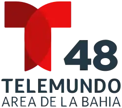 The Telemundo network logo, a T with two circular overlapping components. To the right and under the T, the number 48. Beneath it, in a sans serif on two lines, the word Telemundo and the words "Area de la Bahía", Bay Area in Spanish.