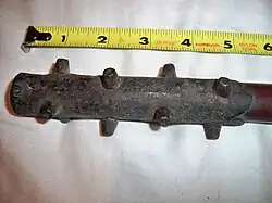 A close-up of the iron studs on an antique Japanese ararebō, a small version of the kanabō