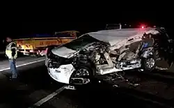 Smashed white minivan