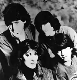 Clockwise from top left: Alex Cooper, Vince de la Cruz, Kimberley Rew, and Katrina Leskanich; 1985
