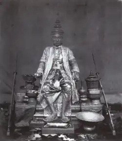 King Mongkut wears the Gown of the Great House of Chakri, the Great Crown of Victory and the Royal Slippers; photo taken around 1851.