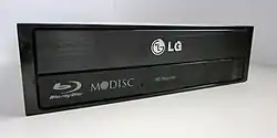 The M-DISC "swirl" logo on an LG Blu-ray optical drive