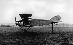 A black and white photograph of the portrait view of the Daimler L8, photographed in 1918 stationary on land. Its tail is held aloft by a support.