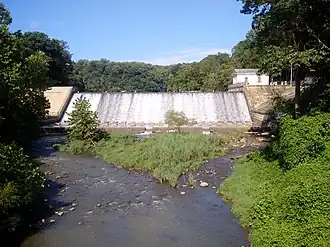 Lake Roland dam and Greek Revival-style marble pumping station (to the right/east) where the Lake Roland outflow becomes the Jones Falls