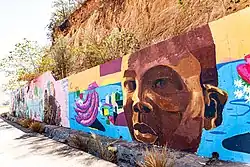 A school project funded by the government of Angola so that the kids can paint this mural. Each school painted one