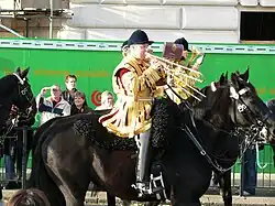 Bandsmen of the Household Cavalry mounted band in state dress, wearing the traditional style of velvet jockey's cap.