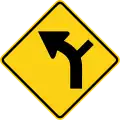 W1-10 (I) Curve left with side road