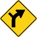 W1-10 (D) Curve right with side road