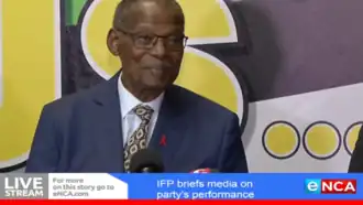 Buthelezi smiling, wearing a three-piece suit