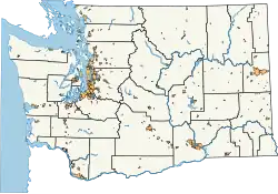A map of Washington with cities highlighted, generally in small and dense clusters; most of the map is not highlighted.
