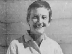 Smiling woman with a pixie hair cut