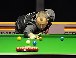 Mark Williams playing a shot