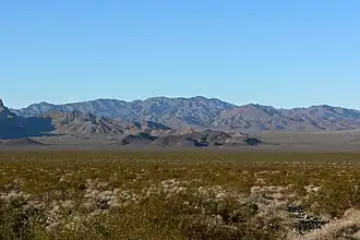 Valley's center-south, from east side. (North end of Highland Range (from east-southeast), McCullough Range massif beyond.)