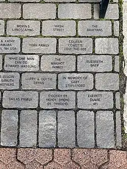 Memorial stones at Ralph Baer memorial including the stone with the binary inscription
