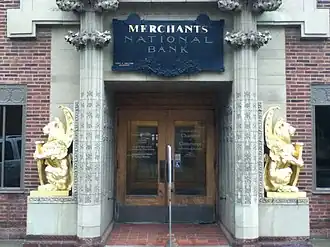 Merchants National Bank entrance with gold winged lions, Grinnell, IA