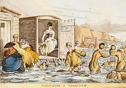 Mermaids at Brighton swim behind their bathing machines in this engraving by William Heath, c. 1829.