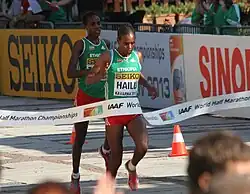 woman crossing the finish line