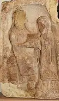 Twelfth century stele depicting Duke Aldaric delivering the deeds of the abbey to his daughter. Defaced during the French Revolution. From Mont Sainte-Odile.