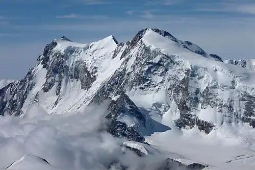 The east and north side with the 600-metre-high (2,000 ft) north face of the Nordend (as seen from the Strahlhorn)