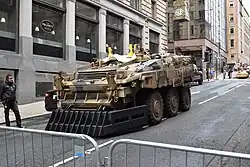 A large armored vehicle on a city street