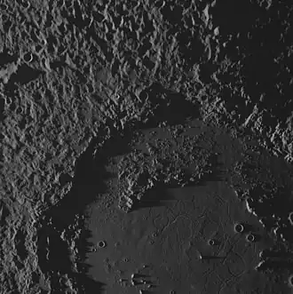 Another MESSENGER image of central and northwestern Mozart, at a low sun angle. Shows the fractures in its smooth floor in bottom right, parts of its peak-ring, and the hummocky ejecta blanket in the upper left.