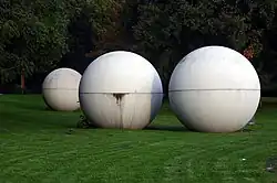 Giant Pool Balls (1977) by Claes Oldenburg and Coosje van Bruggen for Skulptur Projekte Münster, Münster, Germany