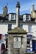 The cross at Musselburgh, East Lothian, topped by the burgh arms