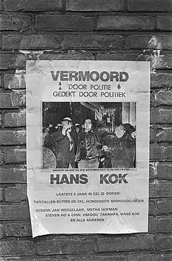 Black and white poster says in Dutch that Hans Kook was murdered by the policed and it was covered up by the police