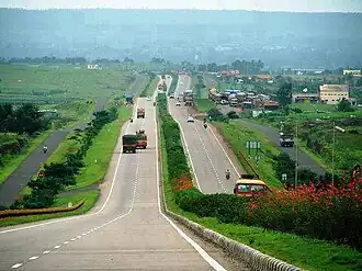 Landscaped four-lane road over rolling terrain