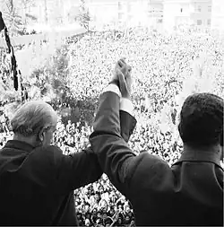 Nasser and Quwatli clasp hands