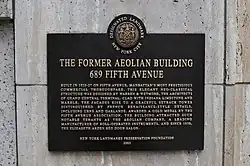 Plaque with the text "The Former Aeolian Building 689 Fifth Avenue"