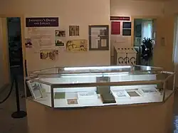 The second main display room at the museum. On the door at center is an extremely rare original poster promoting an Ingersoll speech; such posters were usually printed on high-acid pulp paper and very few have survived. To right of the door is a photo of Ingersoll’s poem in praise of Robert Burns, written when he visited the Burns cottage in Scotland. It is the only poem not by Burns to be displayed at the cottage.
