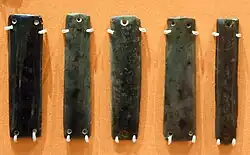 Obsidian jewelry. It is unknown whether they were sewn to clothing or they were joined together to make a necklace, bangle, or belt. 6000-5000 BC
