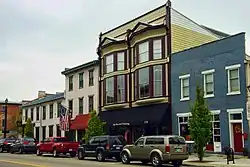 Brick buildings and cars along historic Main Street in Tipp City