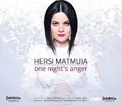 The image depicts a woman staring at the camera with her hands closed