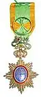 A star badge of the Imperial Order of the Dragon of Annam with the green riband with gold border, used for awarding by French Government.