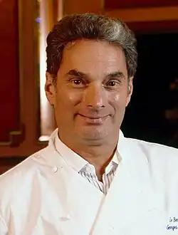 Georges Perrier in a white chef's coat