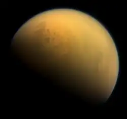 Natural color visible-near infrared view of Titan showing its north polar seas and lakes at upper left.