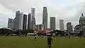 A football match at the Padang set against the Singapore skyline.