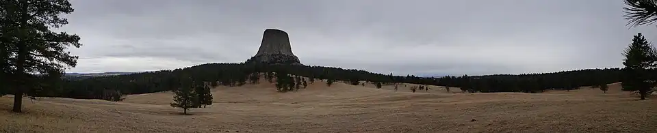 Panorama view of Devils Tower, located in the Bear Lodge Ranger District of the Black Hills, near Hulett and Sundance in Crook County, northeastern Wyoming (2021)