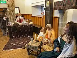 The Family Room in Parke's Castle, showing models of Robert Parke, his wife Ann, and his two younger children, Robert and Maggie, who were drowned in Lough Gill in 1677.