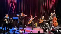 Pearl Django at Jazz Alley in 2025. From left to right: David Lange, Michael Gray, Tim Lerch, Jim Char and Rick Leppanen