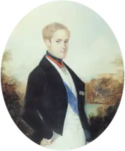 A painting depicting a light-haired young man standing in profile with head turned toward the viewer and wearing a black cutaway coat, white vest and white trousers with a blue sash of office over the vest and the Order of the Golden Fleece suspended on a red ribbon around his neck