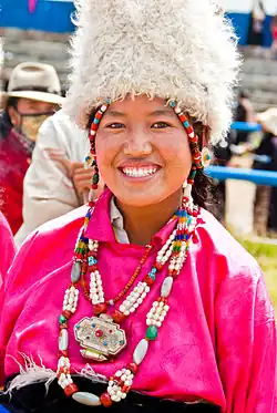 A Tibetan young girl wearing a fur hat
