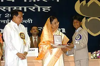 The President, Smt. Pratibha Devisingh Patil presenting the Best Child Artist Award for the year 2005 to Master Sai Kumar for his role in Telugu film “Bommalata – A Bellyful Of Dreams”, at the 53rd National Film Awards function, in New Delhi on September 14, 2007.