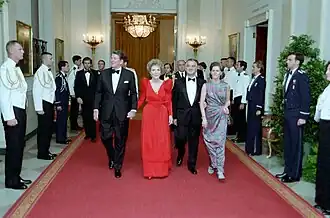 From left to right: U.S. President Ronald Reagan, his wife Nancy, Mexican President Miguel de la Madrid and his wife Paloma Cordero in Cross Hall, White House, during a state dinner, 1984.